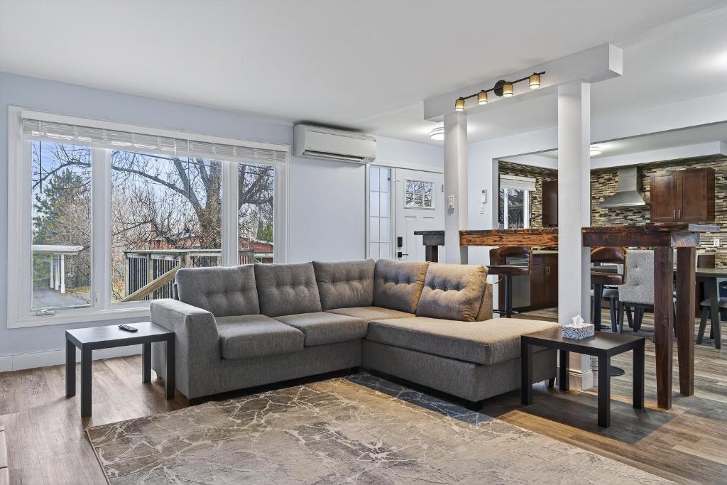 a living room with a couch and a piano at Cozy 3BR Downtown Fredericton Home with Parking in Fredericton