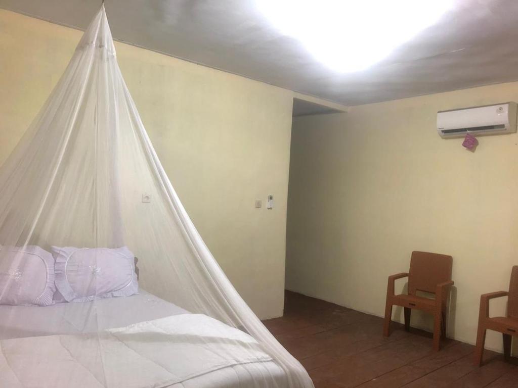 Postel nebo postele na pokoji v ubytování Villa Michella