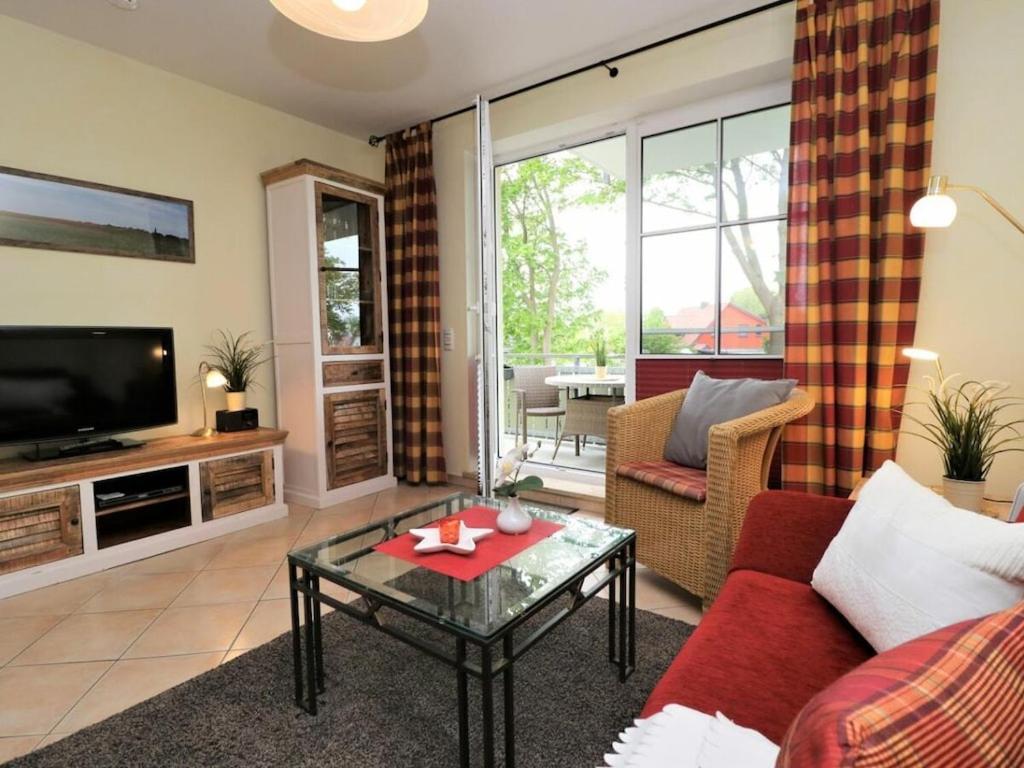 Un televizor și/sau centru de divertisment la Old Waterworks Apt 14