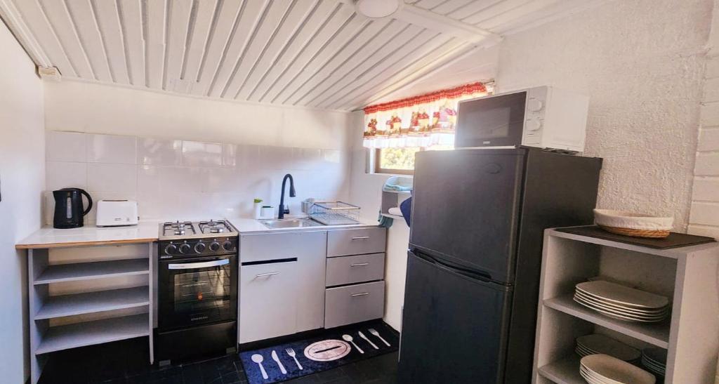 Η κουζίνα ή μικρή κουζίνα στο Cabaña El Hibisco