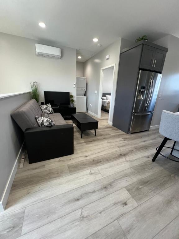 a living room with a couch and a refrigerator at Vacation home in Westminster