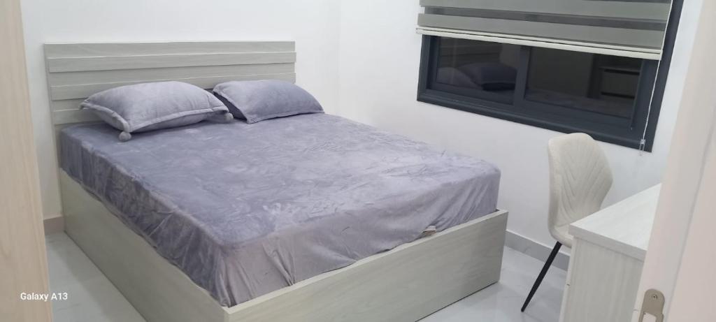 Ένα ή περισσότερα κρεβάτια σε δωμάτιο στο غزو 15