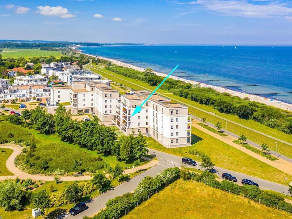 an aerial view of a building next to the ocean at Dream holiday apartment with pool sauna MB in Börgerende-Rethwisch