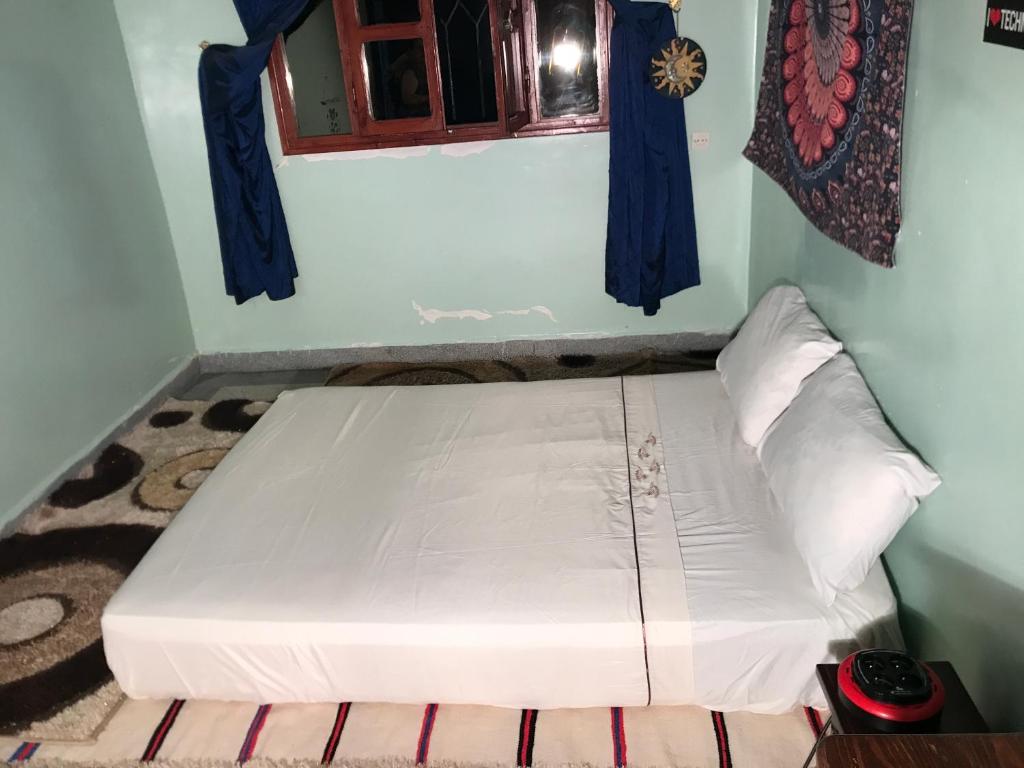 Ένα ή περισσότερα κρεβάτια σε δωμάτιο στο Maison Ait alla tantan