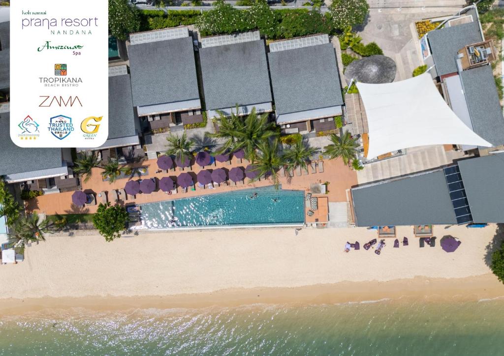 una vista aerea di un resort con piscina e spiaggia di Prana Resort Nandana a Bangrak Beach