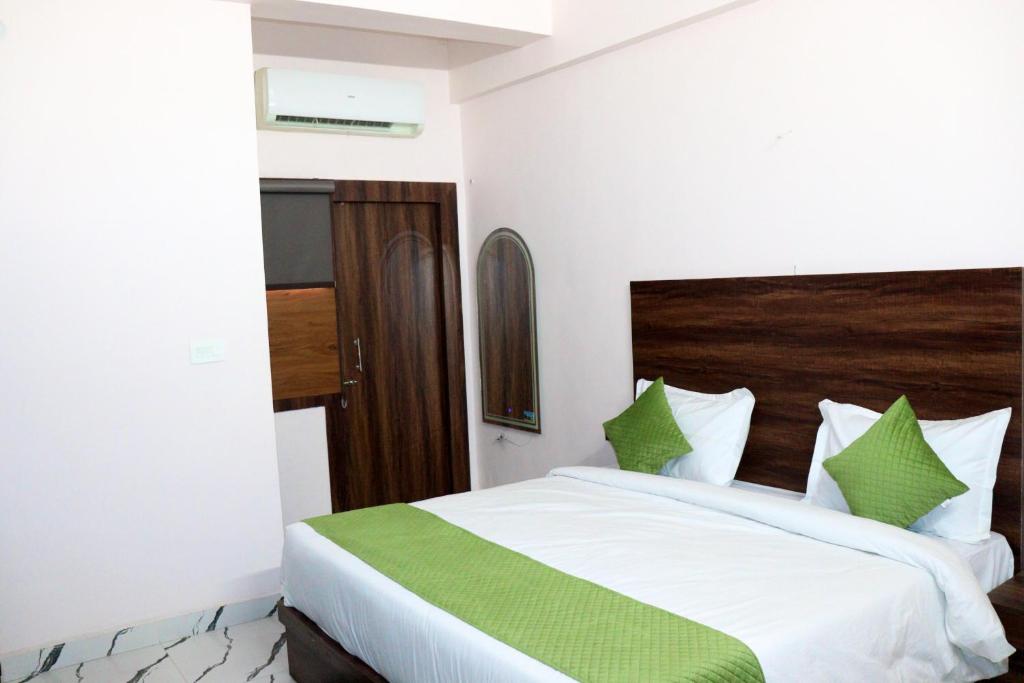 Ένα ή περισσότερα κρεβάτια σε δωμάτιο στο Abharam Retreats