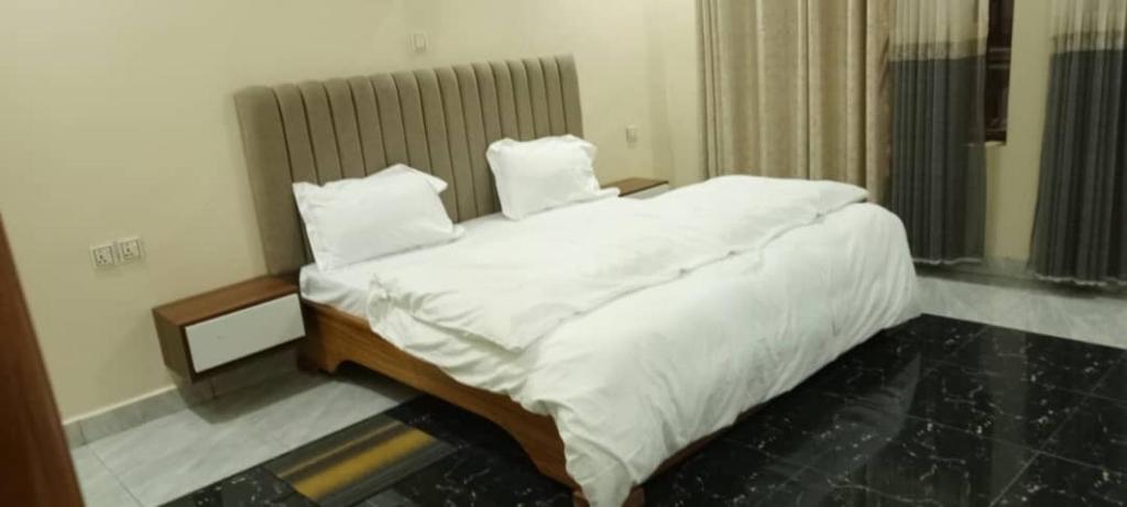 Postel nebo postele na pokoji v ubytování Backpackers Lodge