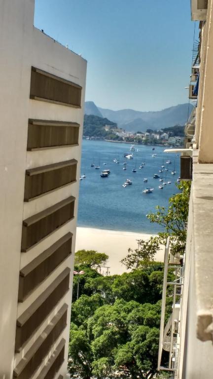 a view of the ocean from a building at Kitinet na Praia de Botafogo in Rio de Janeiro