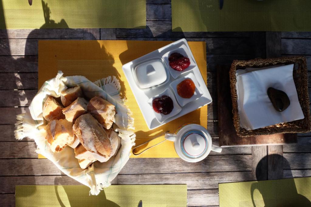 a table with a plate of food and a cup of coffee at casa di Rosa in Patrimonio