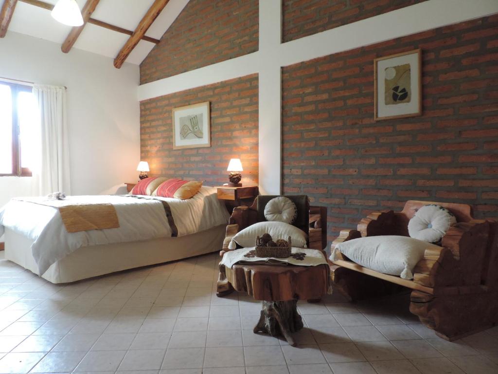 Postel nebo postele na pokoji v ubytování Hosteria El Hoyo