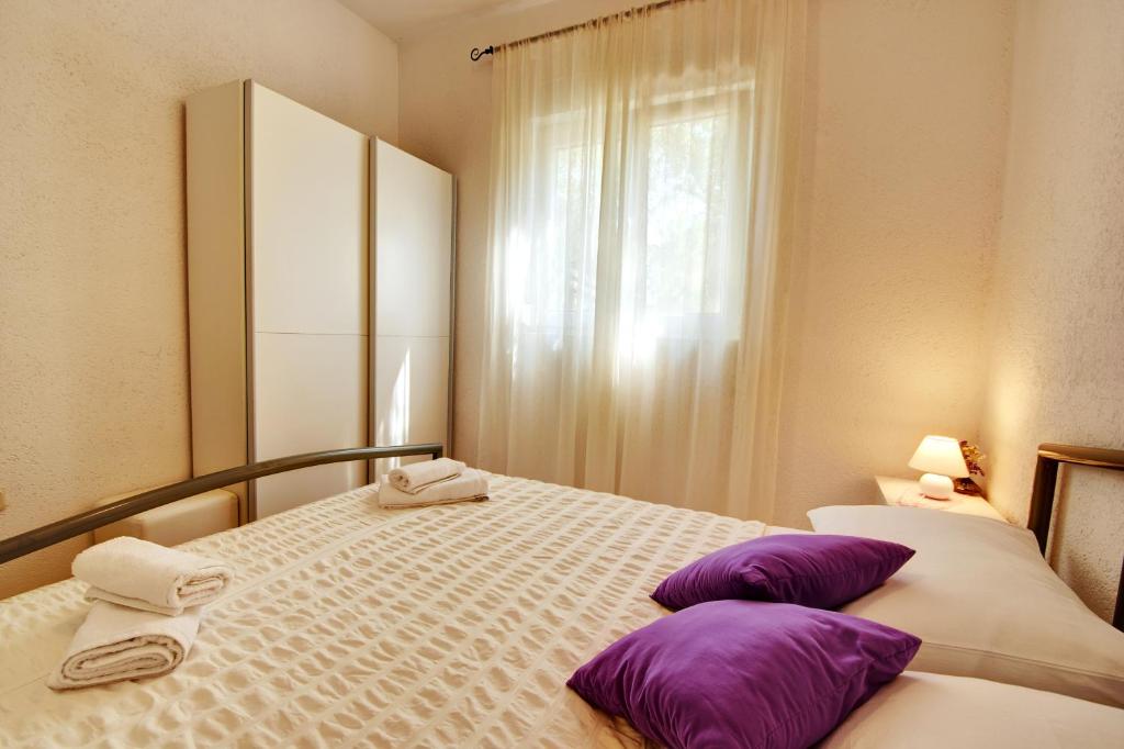Postel nebo postele na pokoji v ubytování Kuća Gašpar