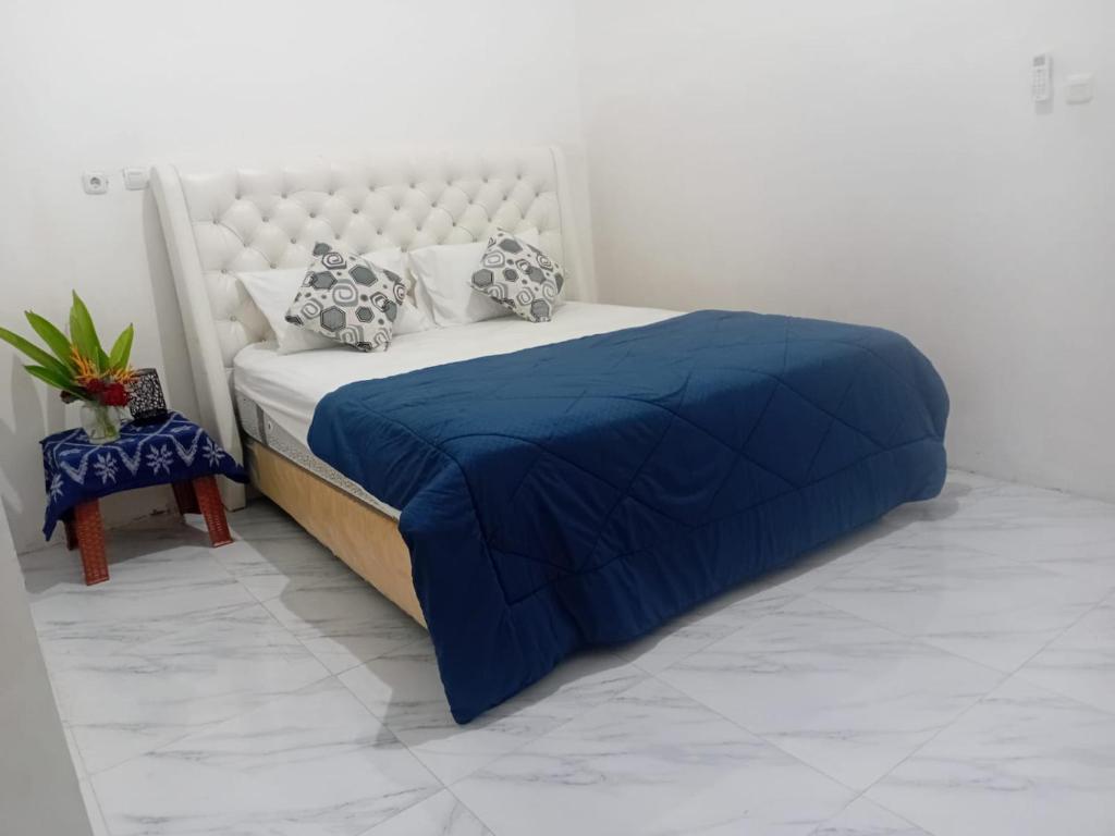 Ένα ή περισσότερα κρεβάτια σε δωμάτιο στο Paris Labuan Bajo Homestay