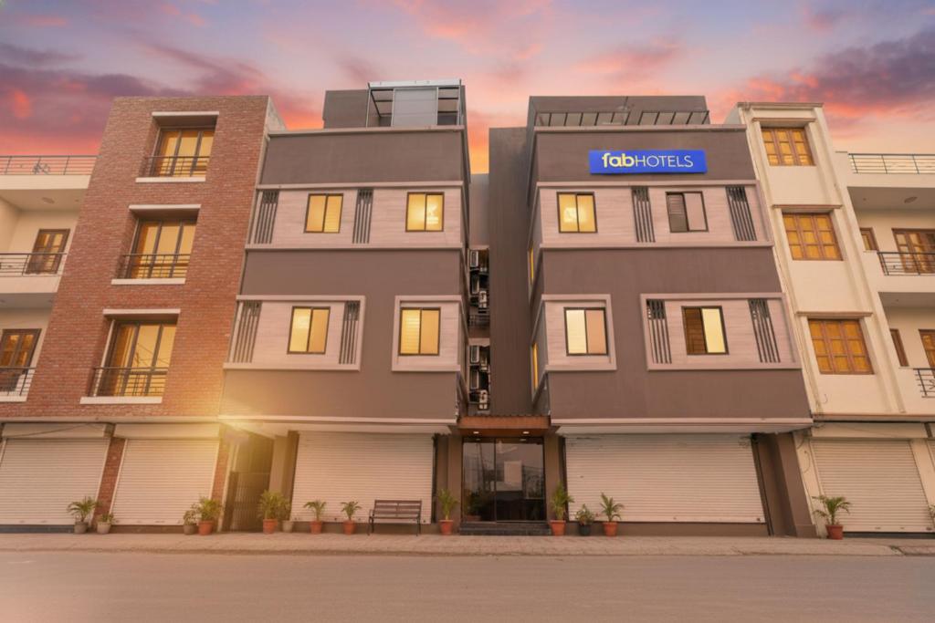 a rendering of a building with a sign on it at Fabhotel Grand Blue in Indore