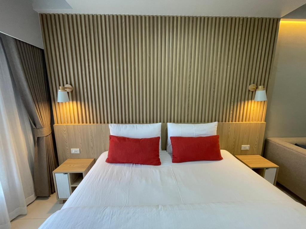 Ένα ή περισσότερα κρεβάτια σε δωμάτιο στο Baan Bangkok 97 Hotel