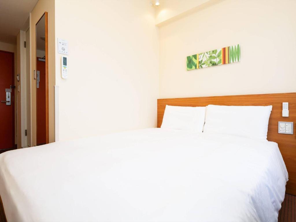 Ένα ή περισσότερα κρεβάτια σε δωμάτιο στο Comfort Inn Kurashiki Mizushima
