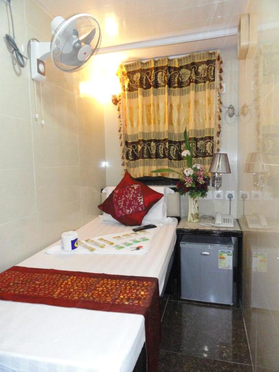Rúm í herbergi á Paris Guest House (D2, 10/F)