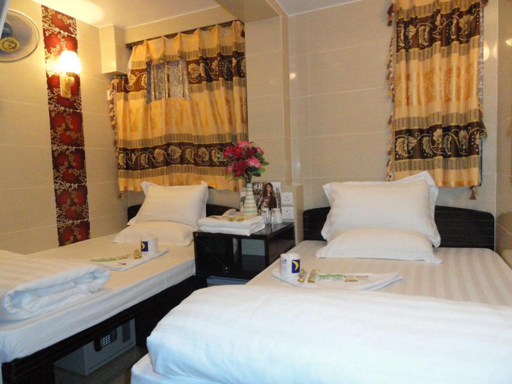 Rúm í herbergi á Paris Guest House (D2, 10/F)