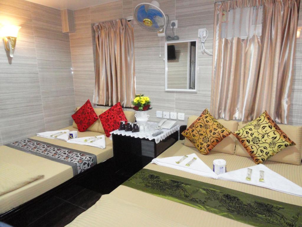 Rúm í herbergi á Paris Guest House (D2, 10/F)