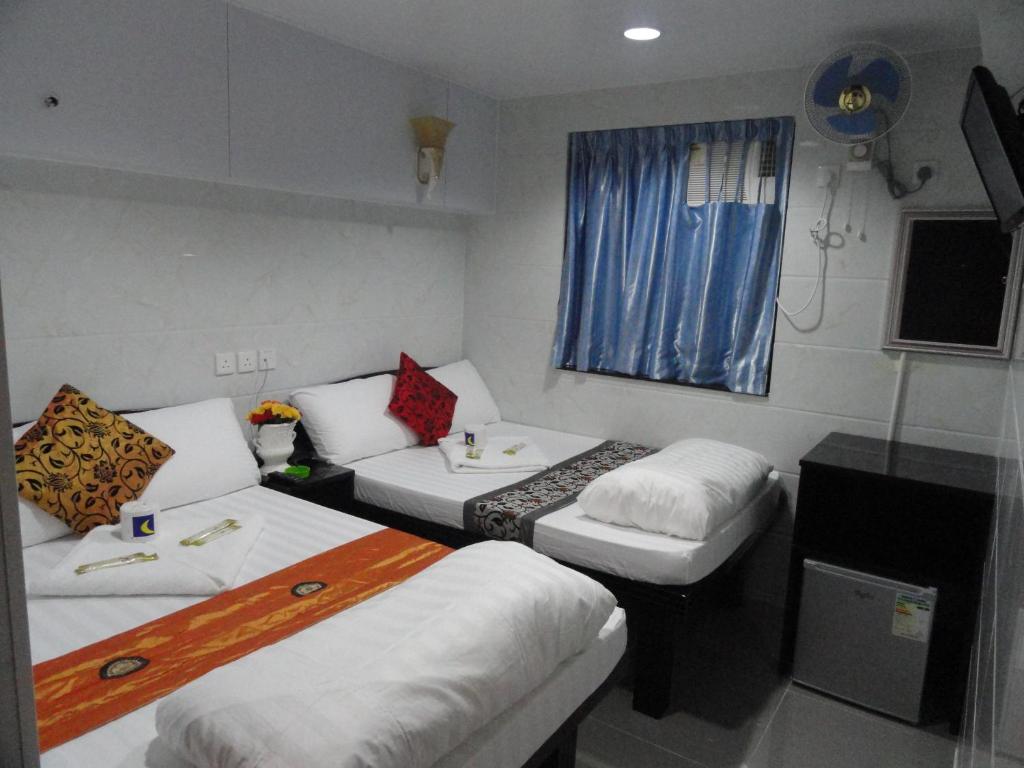 Rúm í herbergi á Paris Guest House (D2, 10/F)