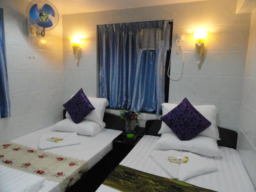 Rúm í herbergi á Paris Guest House (D2, 10/F)