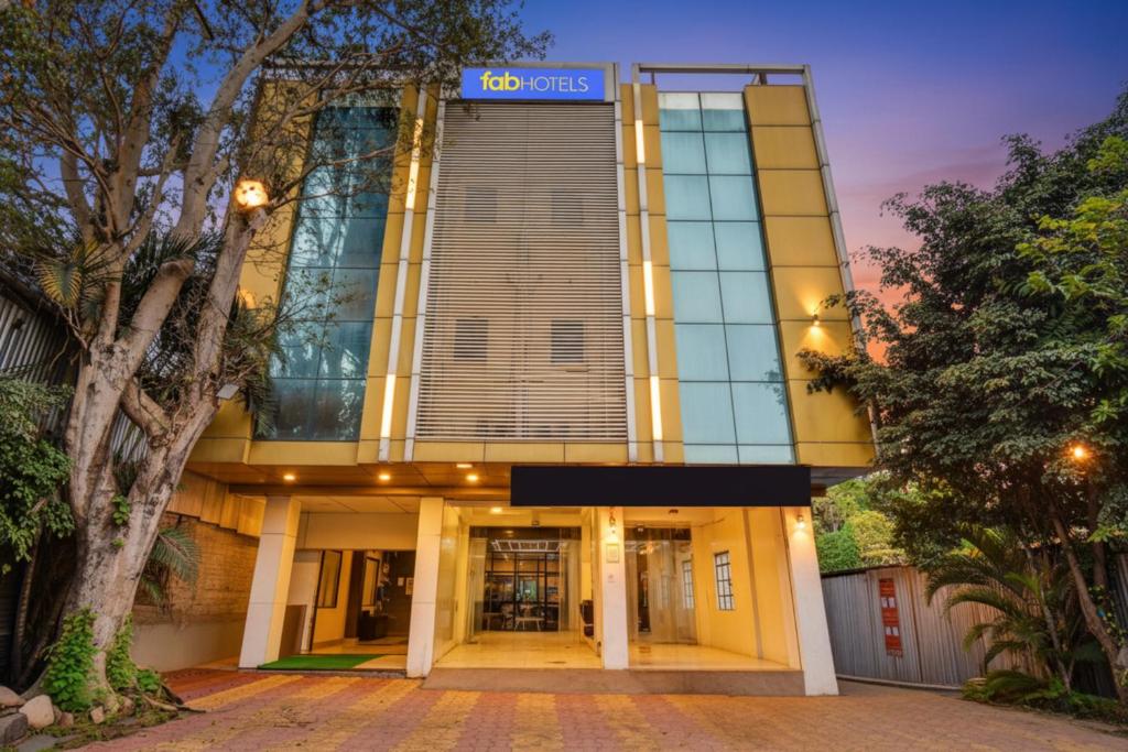 a building with a sign that reads crisis at Via Sun n Shine in Pune