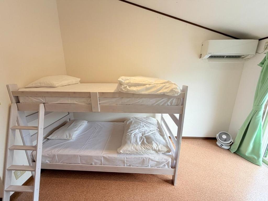 En eller flere senge i et værelse på ハイツ清水205