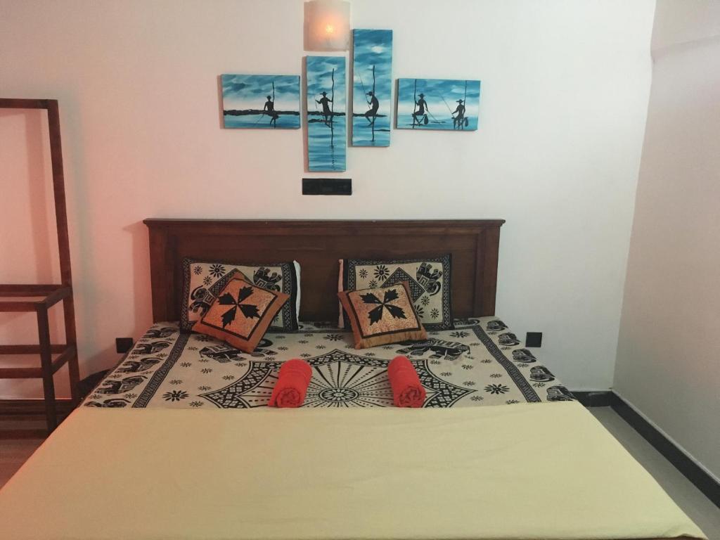 Postel nebo postele na pokoji v ubytování Royal Residence Negombo