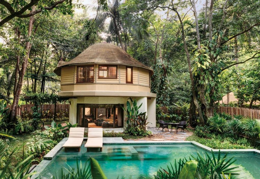 a house with a pool in front of a house at Rayavadee - Pool Pavilion in Railay Beach