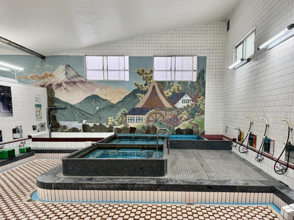 Φωτογραφία από το άλμπουμ του chidori4 伝統的な銭湯の上にある宿広々空間 銭湯無料体験 西九条駅 千鳥橋 USJ σε Wada