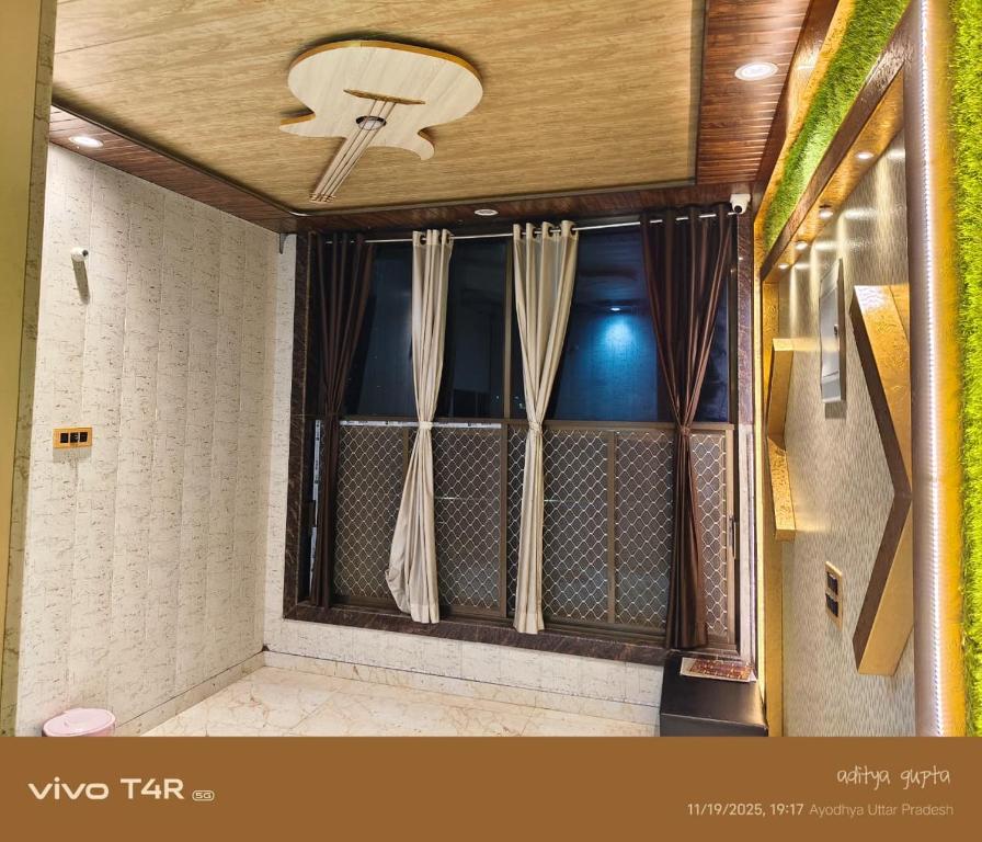 a door with a window with a basketball hoop at Shree Ram Palace in Ayodhya