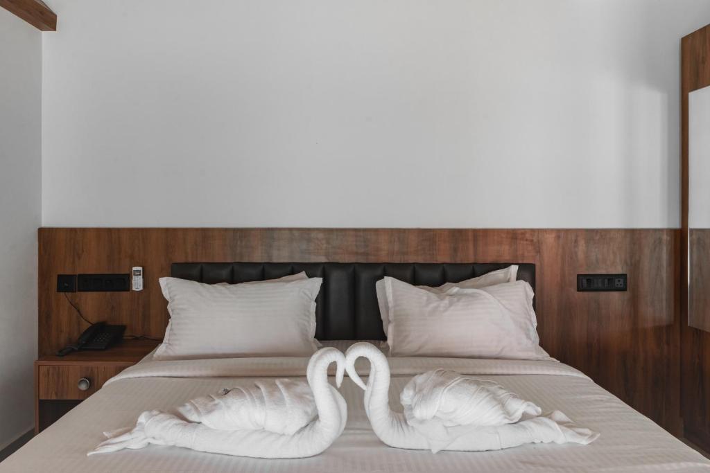 Ένα ή περισσότερα κρεβάτια σε δωμάτιο στο mayanadhi resort