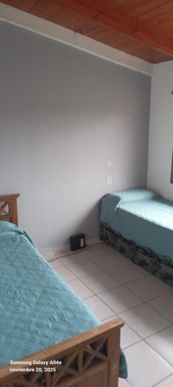 En eller flere senge i et værelse på Depto 4 personas