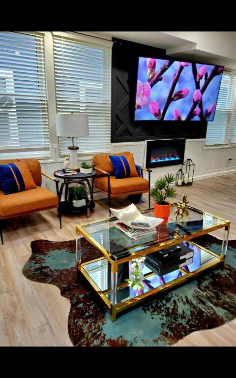 a living room with a coffee table and a tv at Fountain Square Dream Dwelling - Sleeps 8, Near Downtown, Stadiums & Nightlife in Indianapolis