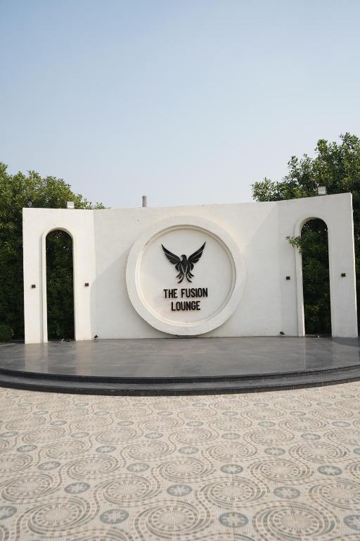 a sign that says the prison house on a building at JBM resort & hotel in Jāmb