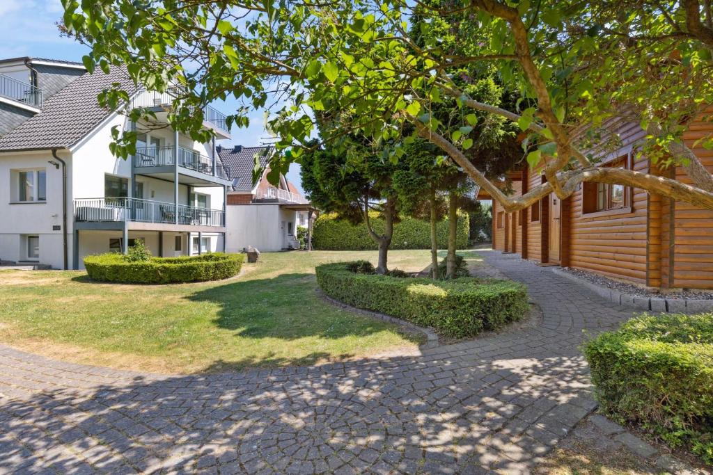 a walkway in front of a house at Strand Quartier in Timmendorfer Strand