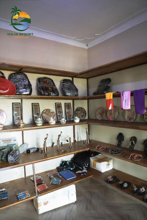 Un estante lleno de muchos grifos en una tienda. en Majik Resort Beach, en Busia