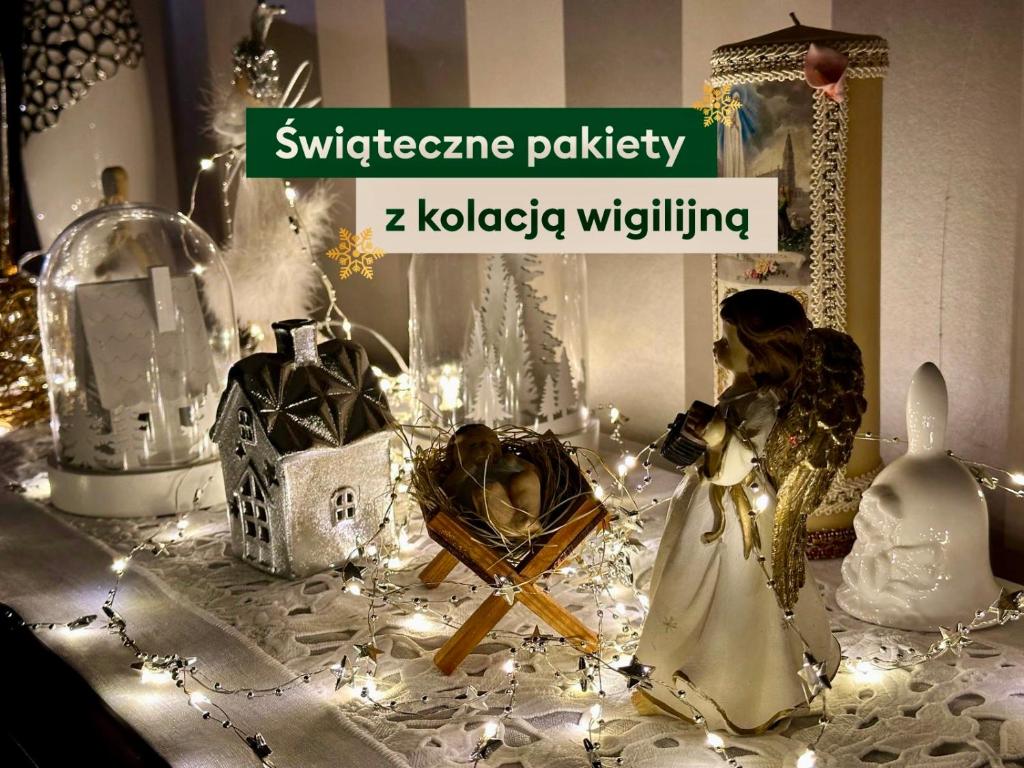 a christmas display with christmas decorations on a table at Bella Monte in Szczyrk