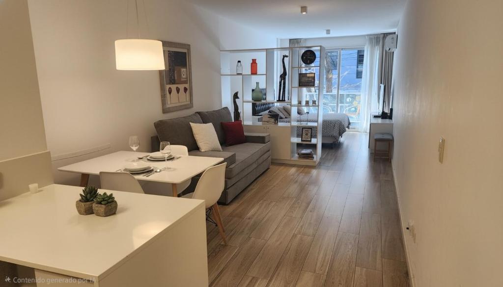 a living room with a couch and a table at Fabuloso departamento con todo y cerca de todo in Buenos Aires
