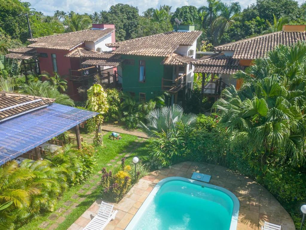 an aerial view of a house with a swimming pool at Flat Barra in Barra Grande