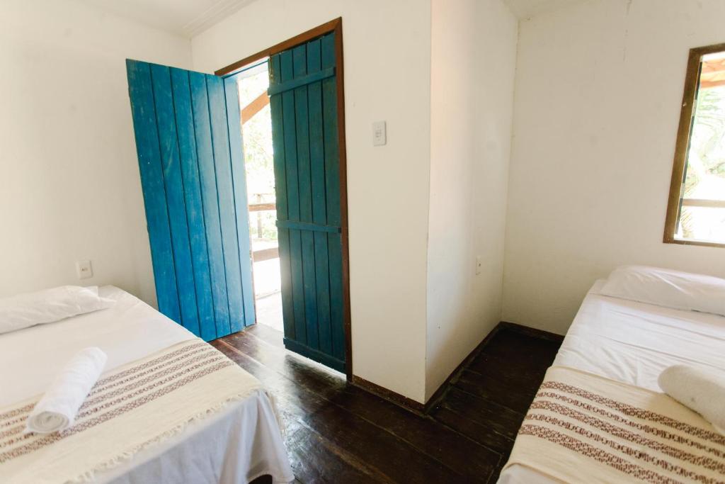 Voodi või voodid majutusasutuse Pura Vida Hostel e Pousada - Boipeba toas