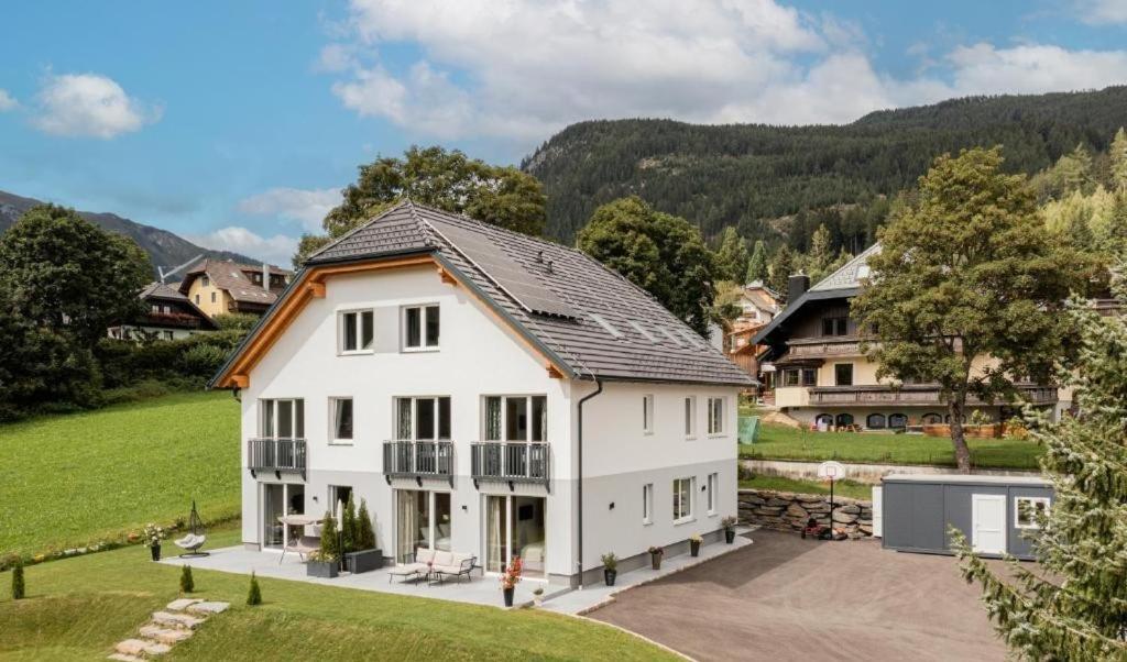 an aerial view of a white house at Granit Appartements in Mauterndorf