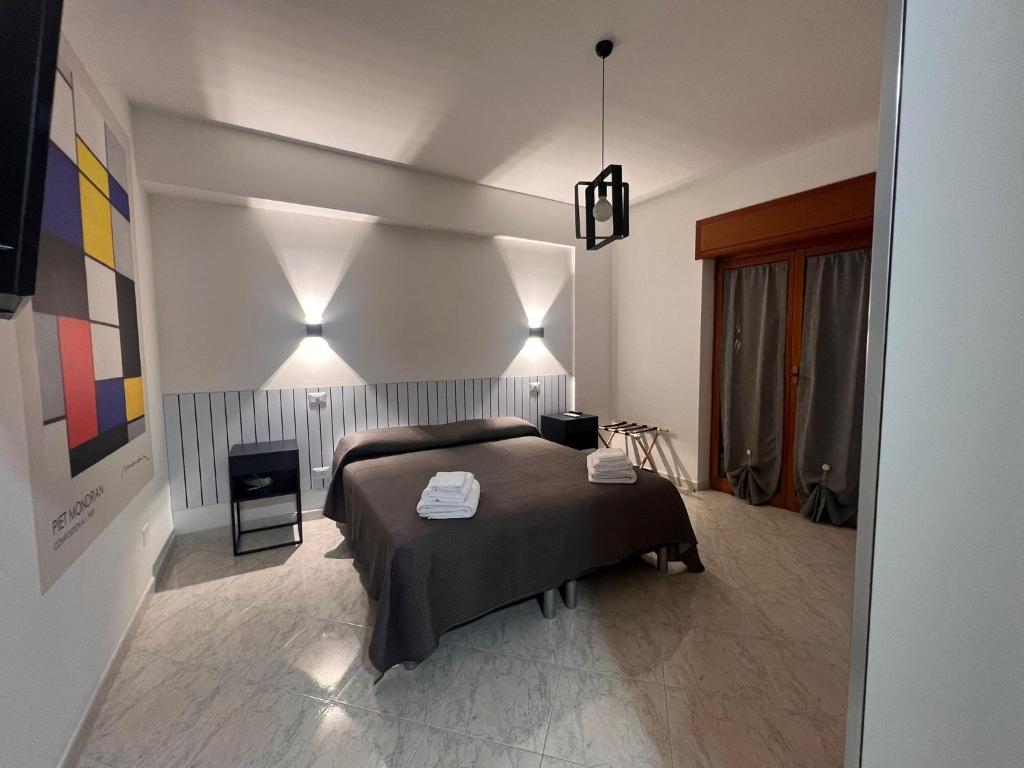 Ένα ή περισσότερα κρεβάτια σε δωμάτιο στο Casa Procida