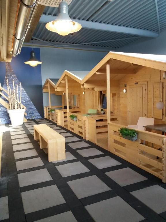 a room with a row of wooden huts at Studio long term stay in Makkum in Makkum