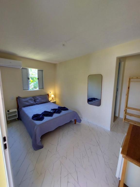 Giường trong phòng chung tại Suíte do Deca - 500M do Centro Histórico