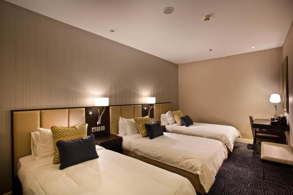 Postel nebo postele na pokoji v ubytování Ambassador Transit Hotel - Terminal 3