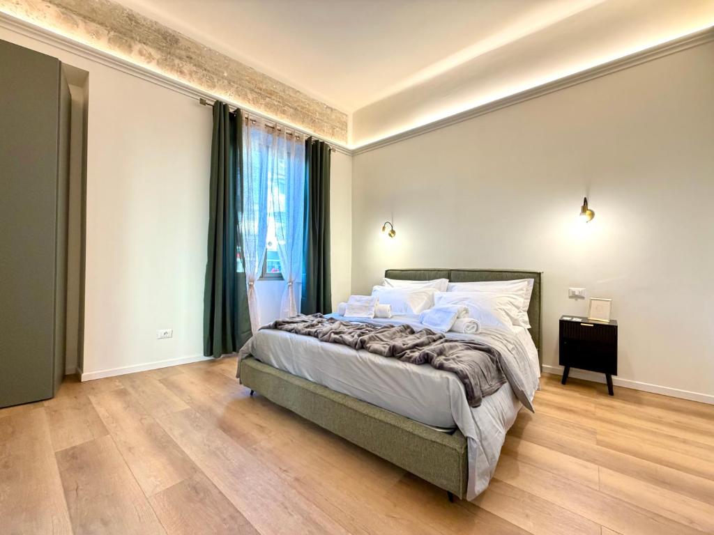 En eller flere senge i et værelse på Cortela Dimora Scaligera