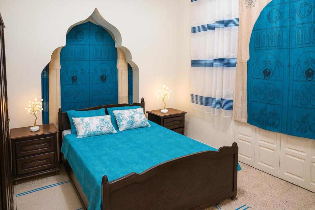 Una cama o camas en una habitación de Chez Naceur Suite
