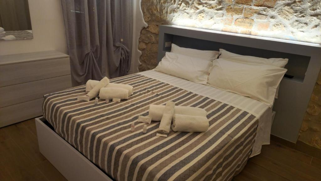 Ένα ή περισσότερα κρεβάτια σε δωμάτιο στο La Casa dei DOGI