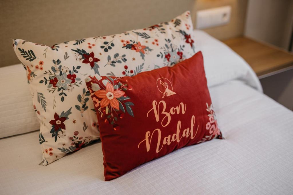 Una cama o camas en una habitación de Hotel Catalunya Ribes de Freser