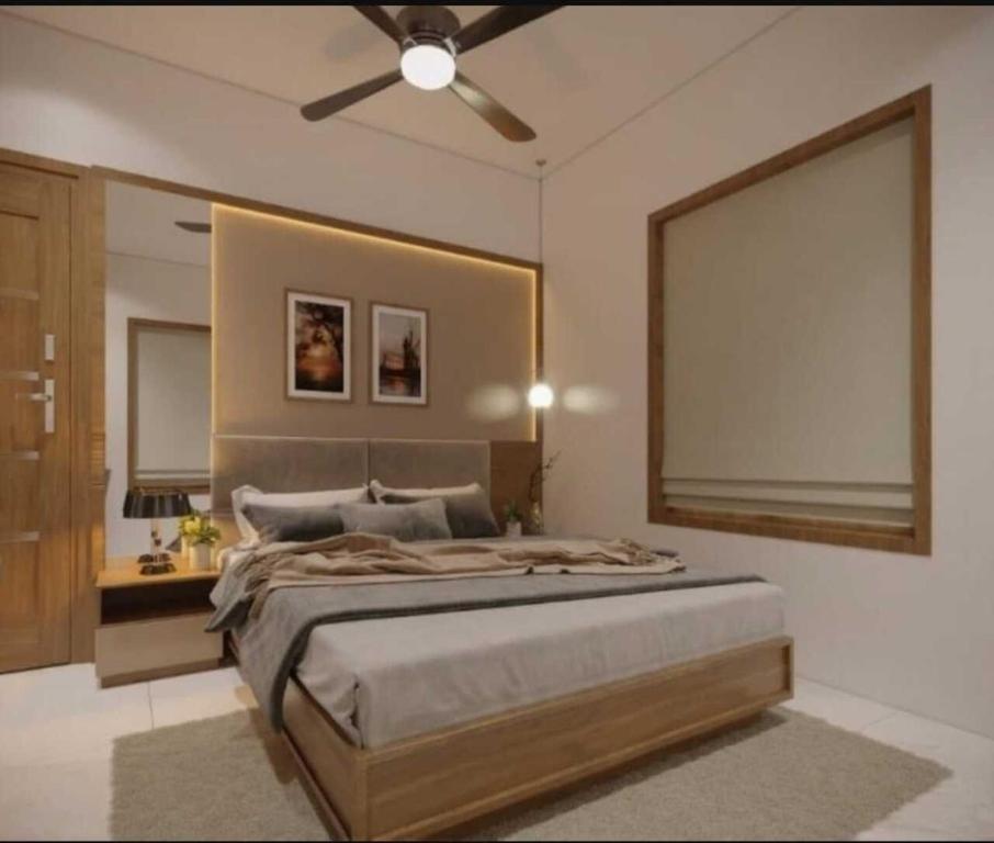 En eller flere senge i et værelse på The Serenity Suites